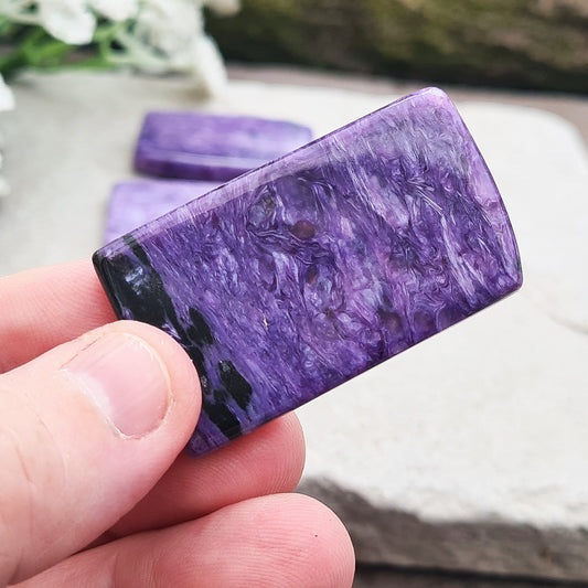 Charoite Crystal, polished slice from Russia. Fabulous patterning beautiful purple colouring. These slices are just so handy for keeping on you, putting on the body, including them in a crystal grid and so much more.