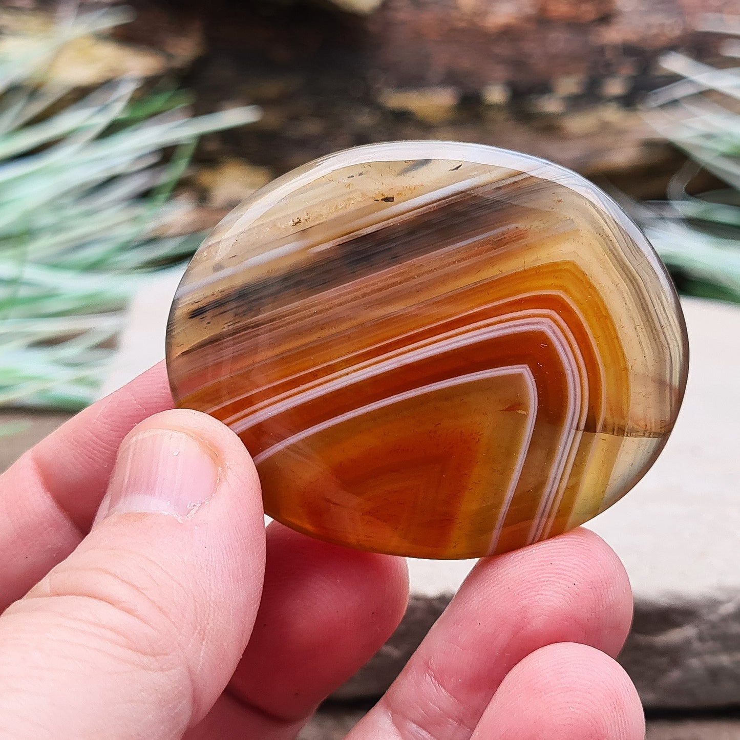 Carnelian and Agate Crystal Palm Stone. From Madagascar. This palm stone has a wonderful orange and grey banded colouring.