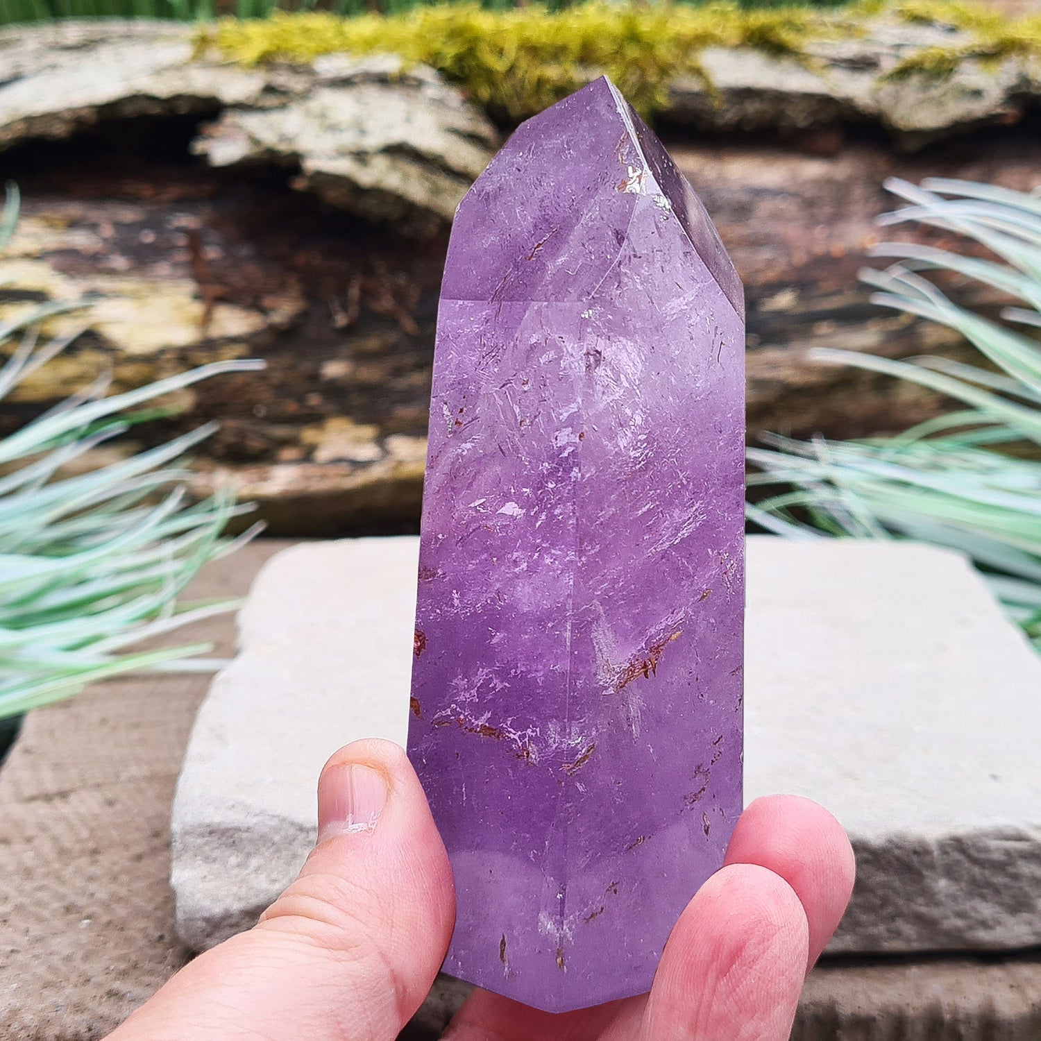 Amethyst Tower from Brazil. This polished crystal has great purple colouring. Faces are 7,3,7,3,7,3 sides. Some Iron Ore mineral inclusions.