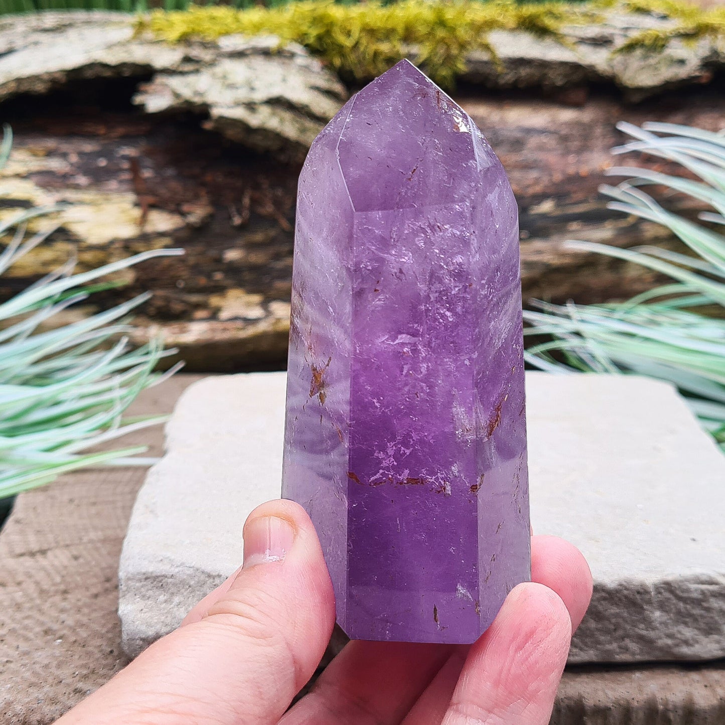 Amethyst Tower from Brazil. This polished crystal has great purple colouring. Faces are 7,3,7,3,7,3 sides. Some Iron Ore mineral inclusions.