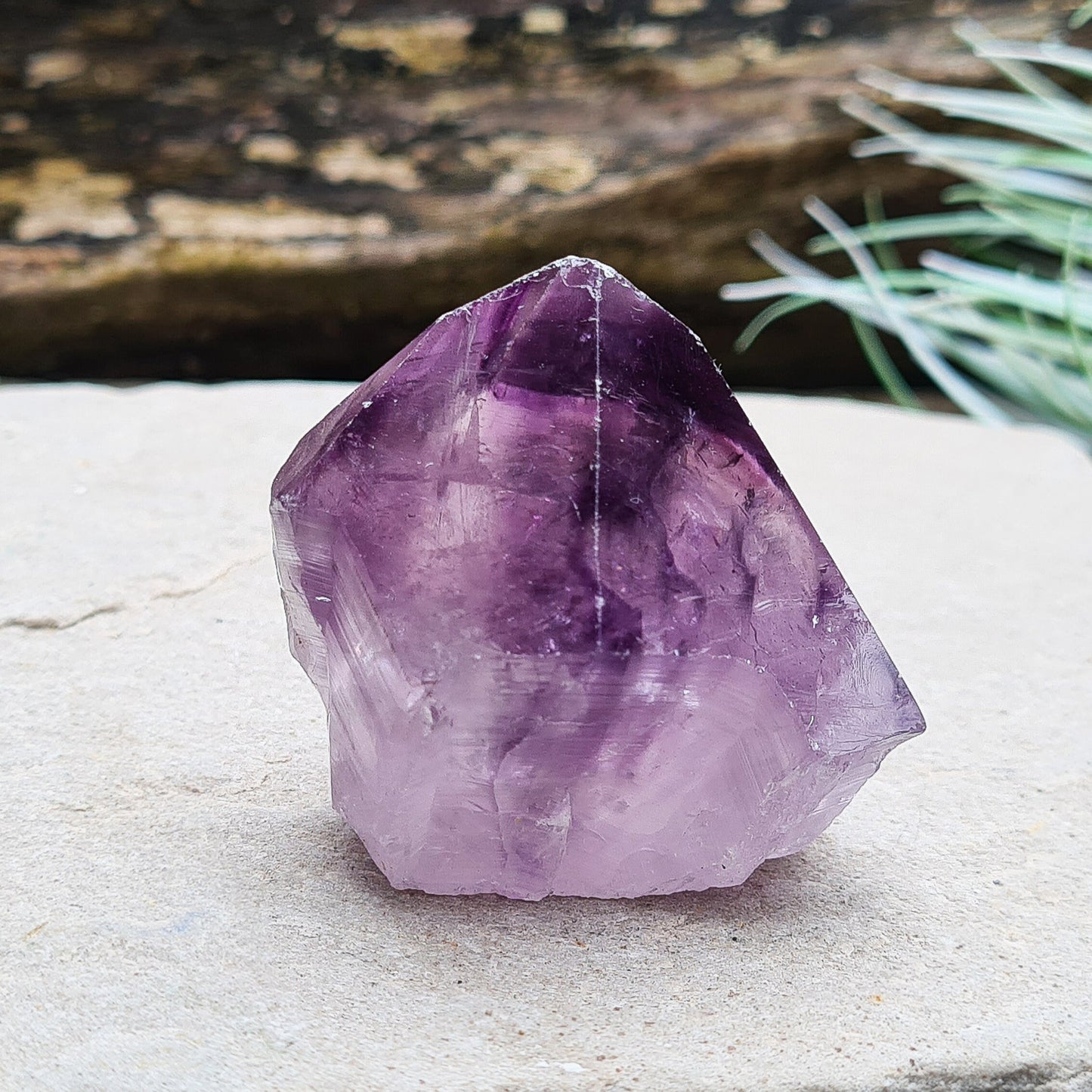 Amethyst crystal standing point with cut base from Brazil. This is a great crystal with dark purple colouring. Point is polished, the rest is left natural.