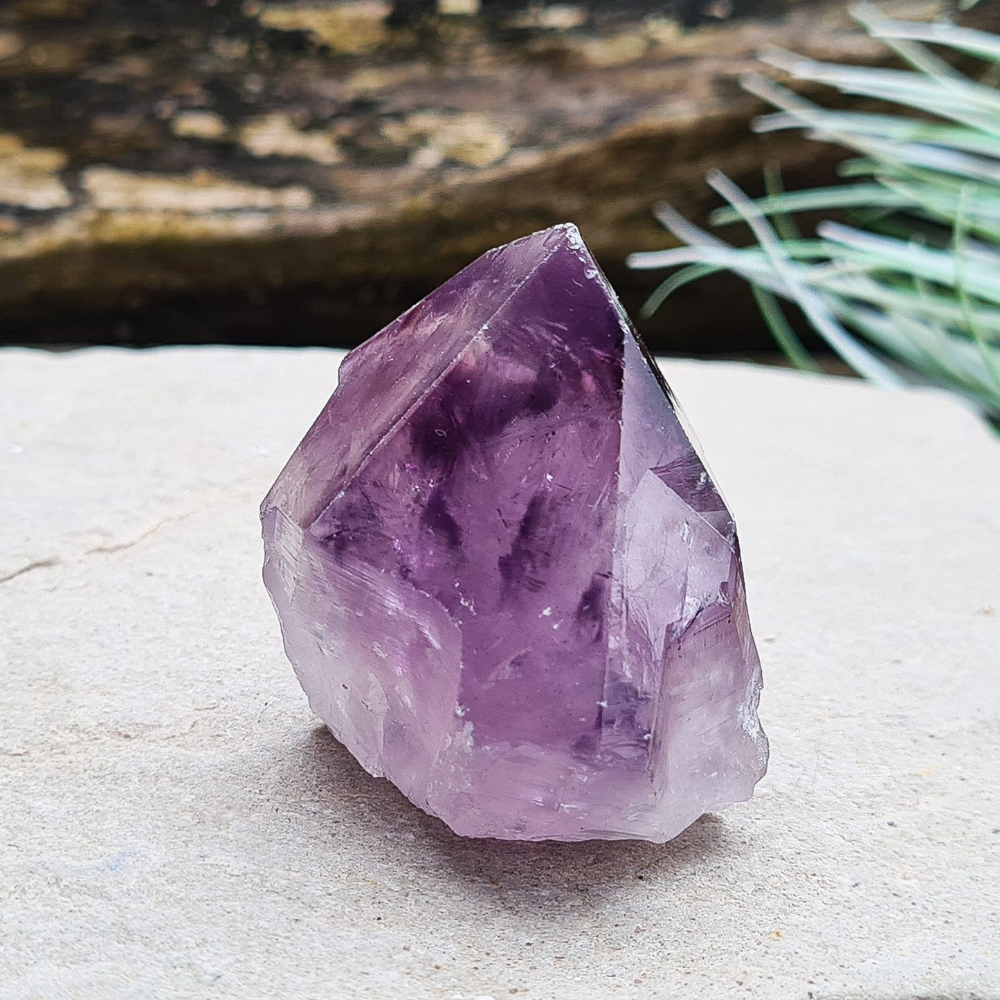 Amethyst crystal standing point with cut base from Brazil. This is a great crystal with dark purple colouring. Point is polished, the rest is left natural.