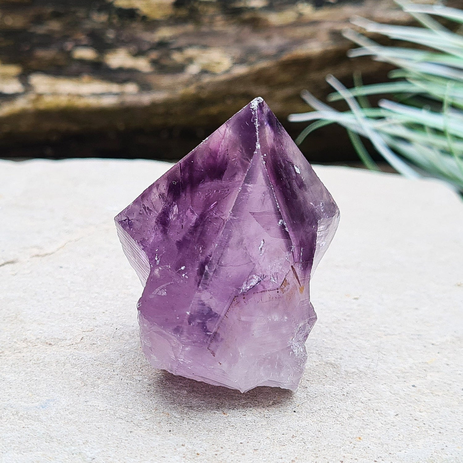 Amethyst crystal standing point with cut base from Brazil. This is a great crystal with dark purple colouring. Point is polished, the rest is left natural.