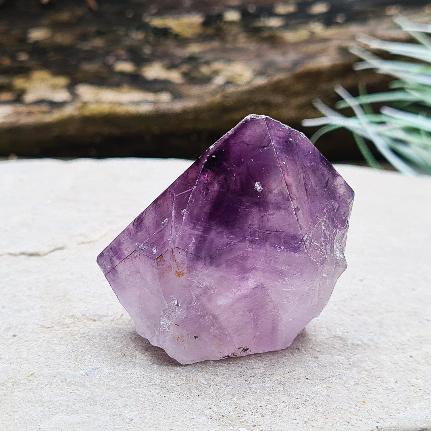 Amethyst crystal standing point with cut base from Brazil. This is a great crystal with dark purple colouring. Point is polished, the rest is left natural.