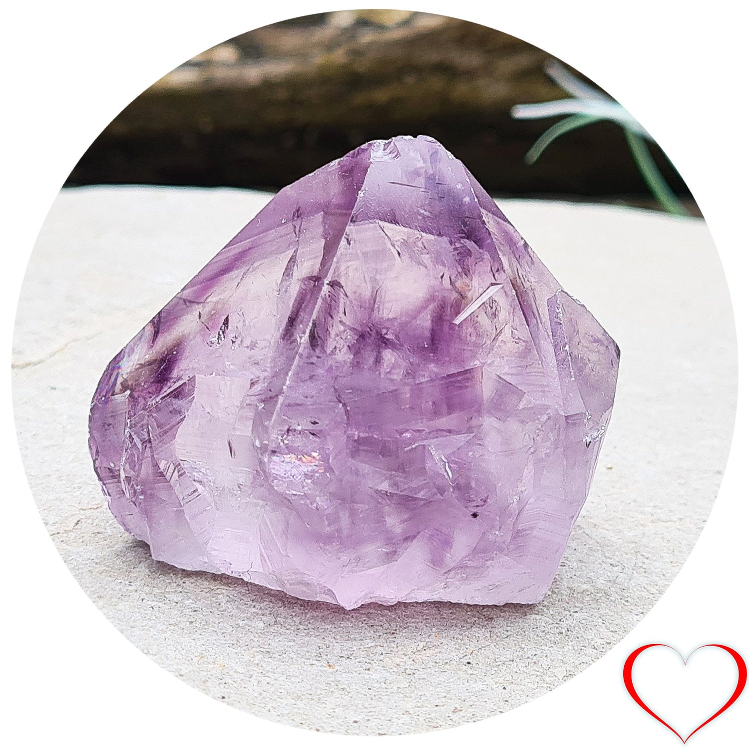 Amethyst crystal standing point from Brazil with a polished tip and a flat cut base. Features beautiful translucent purple coloring, while the remaining surface is left natural.