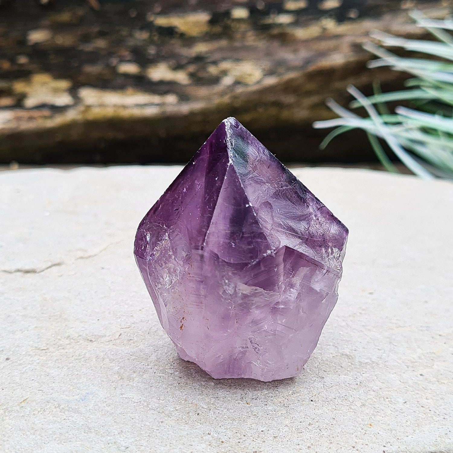 Amethyst crystal standing point with cut base from Brazil. This is a great crystal with dark purple colouring. Point is polished, the rest is left natural.