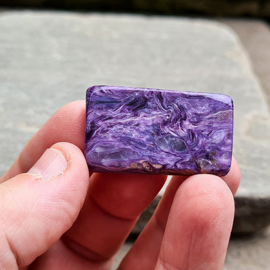 Charoite Crystal, polished slice from Russia. Beautiful patterning and fabulous purple colouring. These slices are just so handy for keeping on you, putting on the body, including them in a crystal grid and so much more.