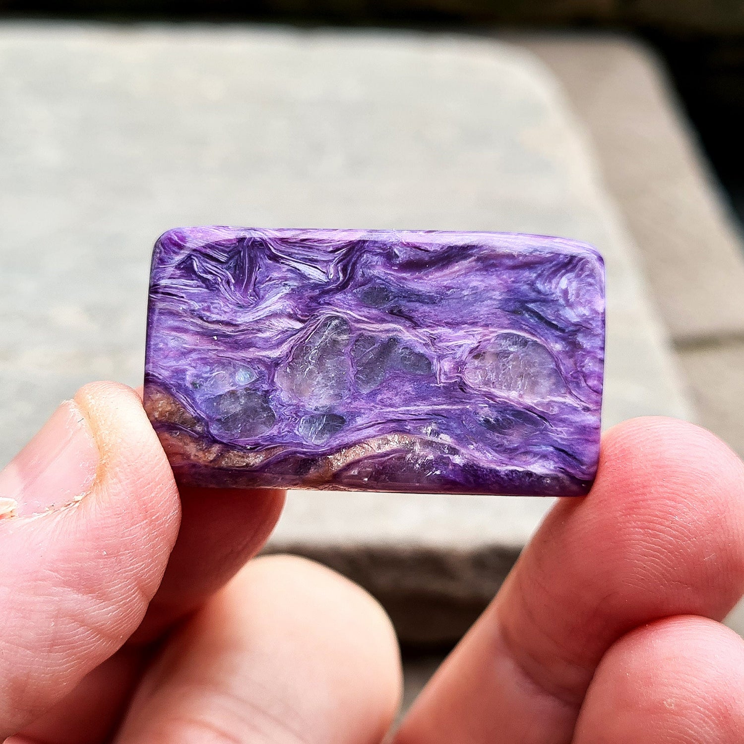 Charoite Crystal, polished slice from Russia. Beautiful patterning and fabulous purple colouring. These slices are just so handy for keeping on you, putting on the body, including them in a crystal grid and so much more.