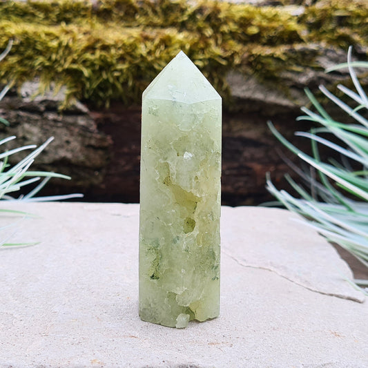 Prehnite Crystal Tower, point is a 6 sided Generator, has lovely natural cavities so you can see the crystalline structure within it. 