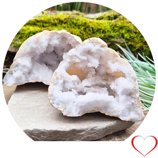 White Quartz Crystal Geode Pair, from Morocco. Lovely sparkling white quartz crystal formations in both sections of the geode. Each can sit on a flat surface on its own.