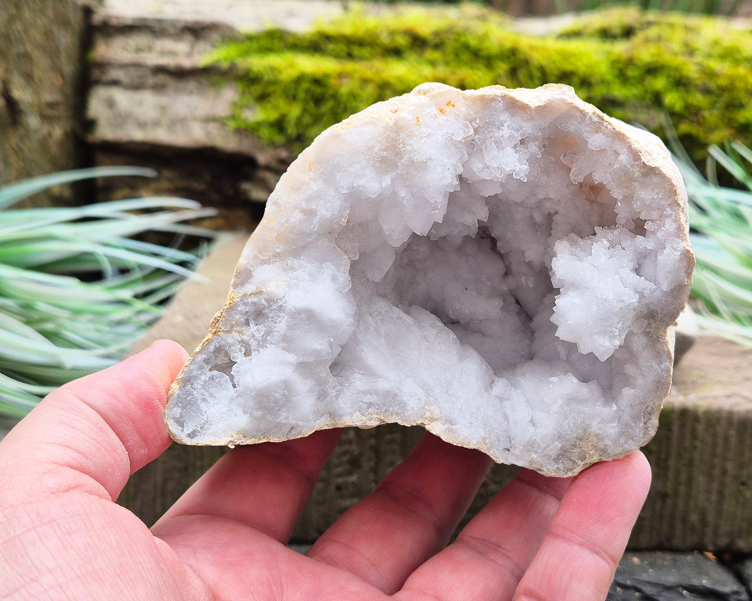 White Quartz Crystal Geode Pair, from Morocco. Lovely sparkling white quartz crystal formations in both sections of the geode. Each can sit on a flat surface on its own.