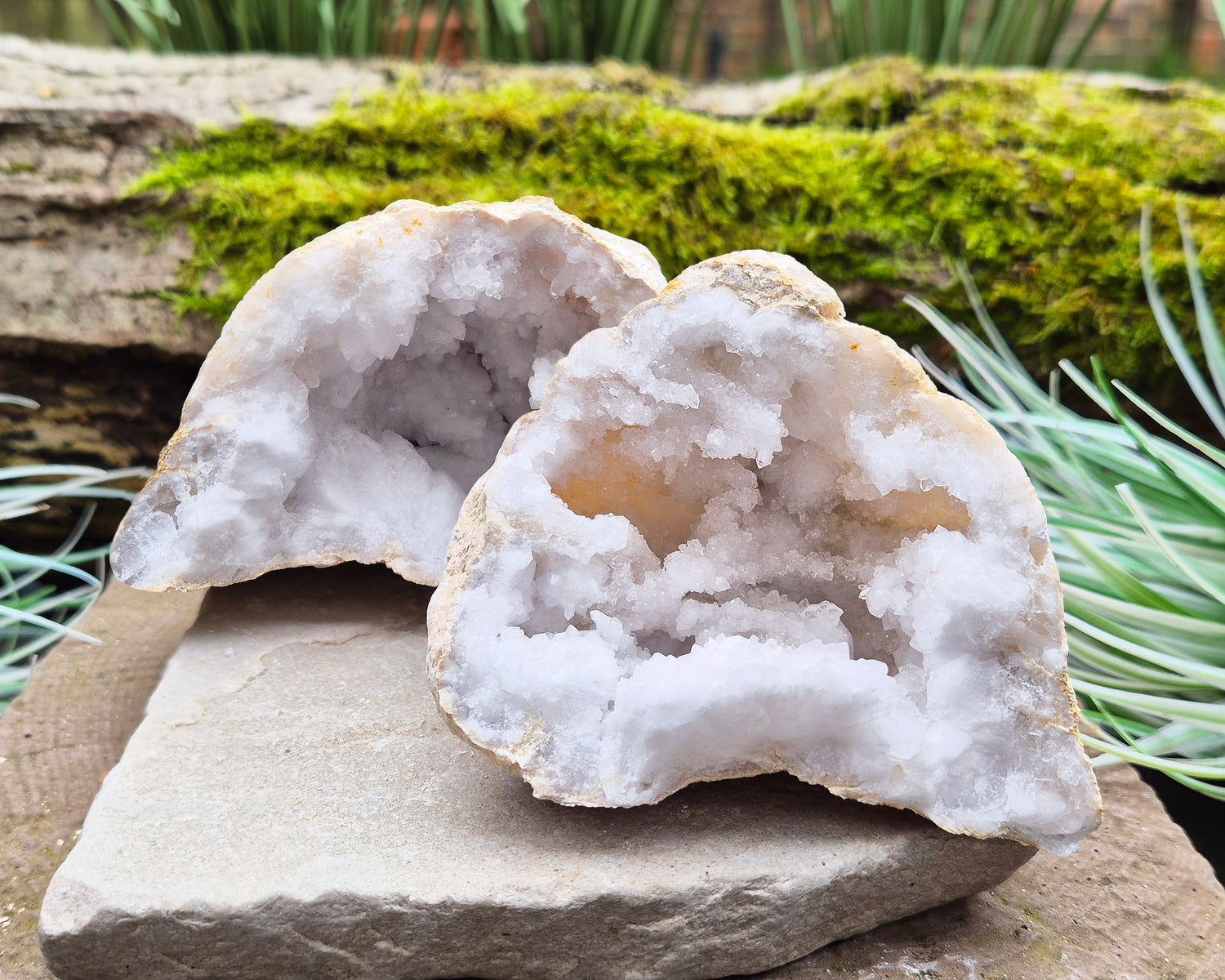 White Quartz Crystal Geode Pair, from Morocco. Lovely sparkling white quartz crystal formations in both sections of the geode. Each can sit on a flat surface on its own.