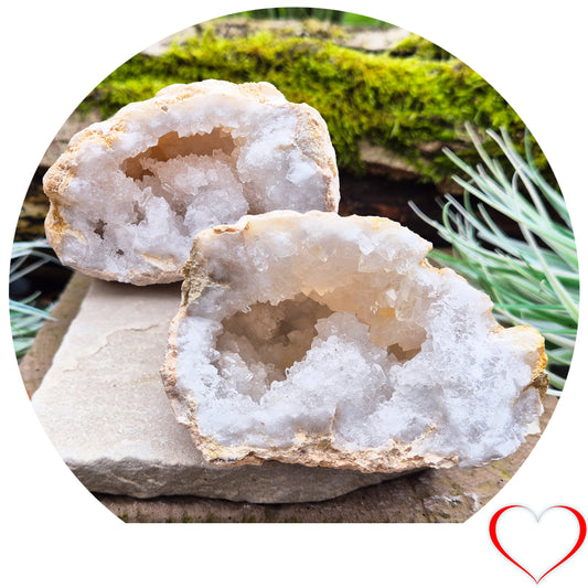 White Quartz Crystal Geode Pair, from Morocco. Lovely sparkling white quartz crystal formations in both sections of the geode. I will include a clear acrylic stand for one of the section to sit on.