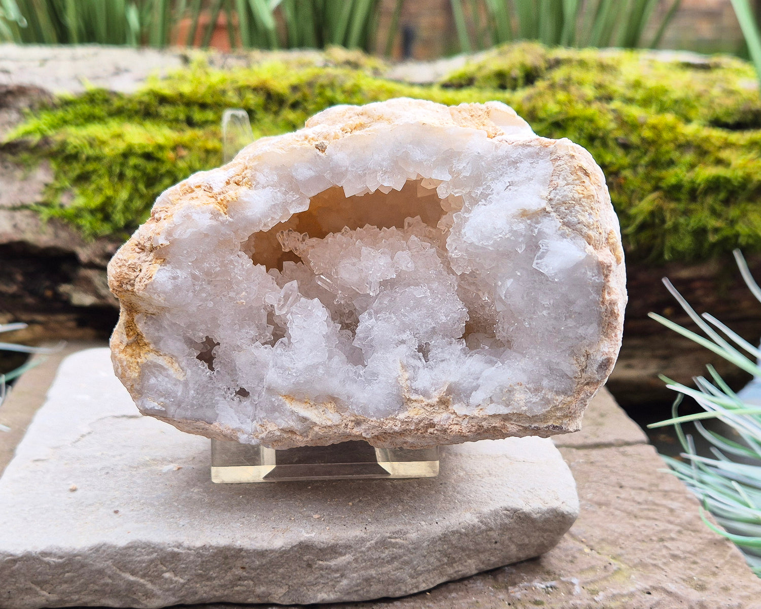 White Quartz Crystal Geode Pair, from Morocco. Lovely sparkling white quartz crystal formations in both sections of the geode. I will include a clear acrylic stand for one of the section to sit on.