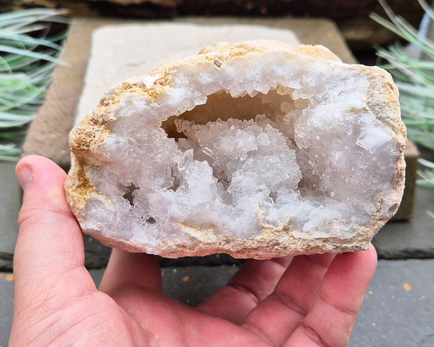 White Quartz Crystal Geode Pair, from Morocco. Lovely sparkling white quartz crystal formations in both sections of the geode. I will include a clear acrylic stand for one of the section to sit on.