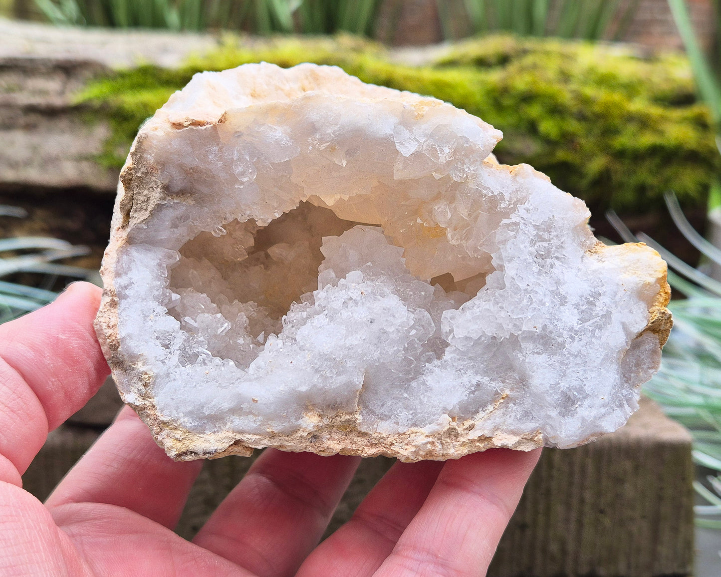 White Quartz Crystal Geode Pair, from Morocco. Lovely sparkling white quartz crystal formations in both sections of the geode. I will include a clear acrylic stand for one of the section to sit on.