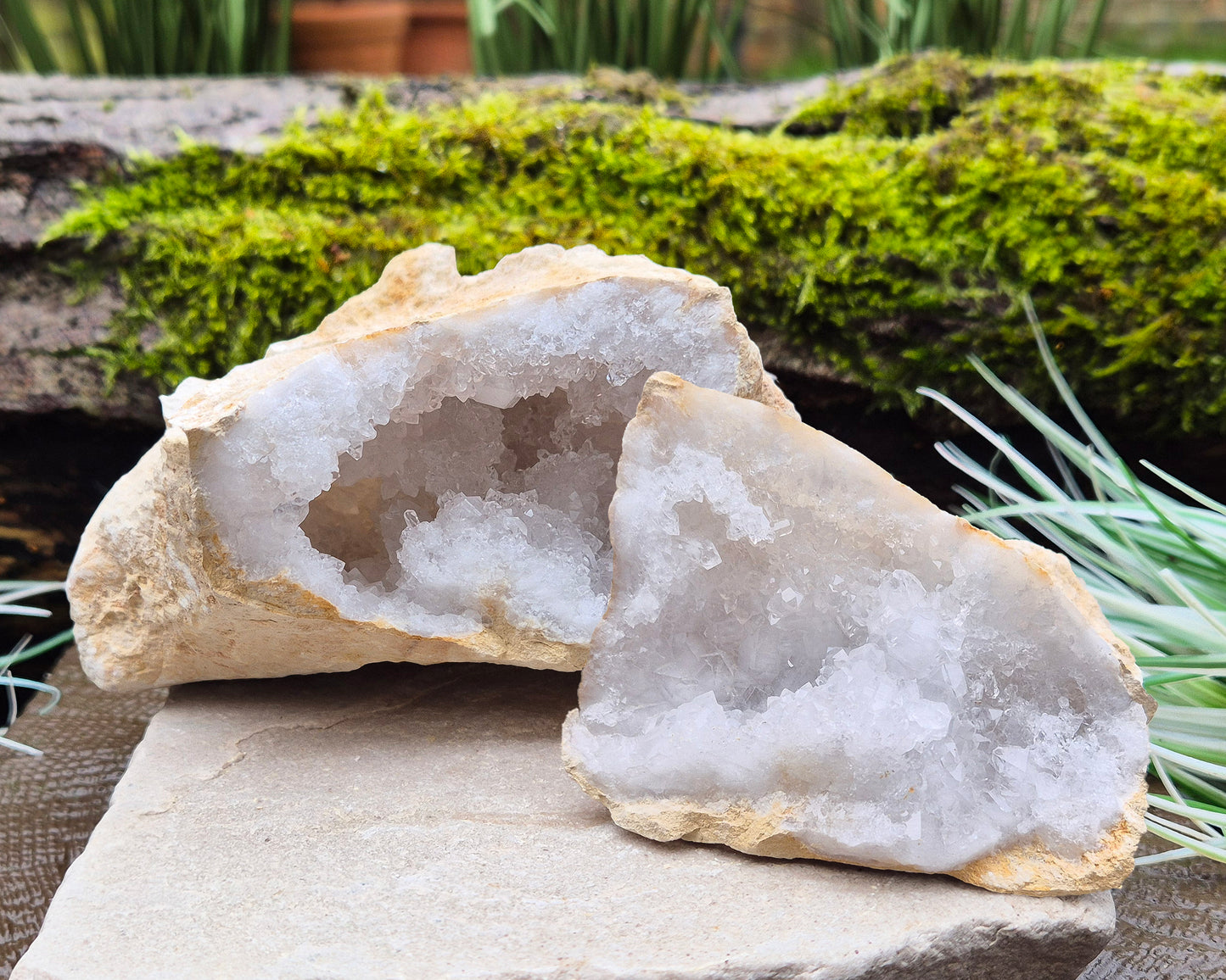 White Quartz Crystal Geode Pair, from Morocco. Lovely sparkling white quartz crystal formations in both sections of the geode. Both pieces self stand.