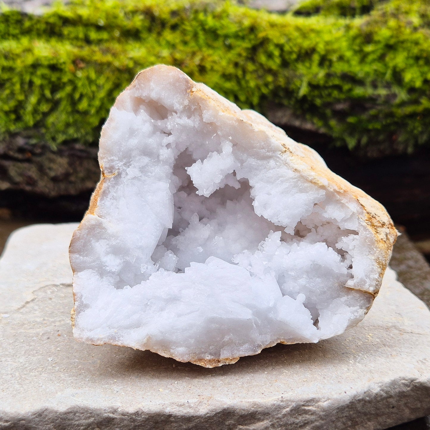 White Quartz Crystal Geode Half, from Morocco. Jam packed with lovely sparkling white quartz crystal formations. It can sit on its own on an even surface.