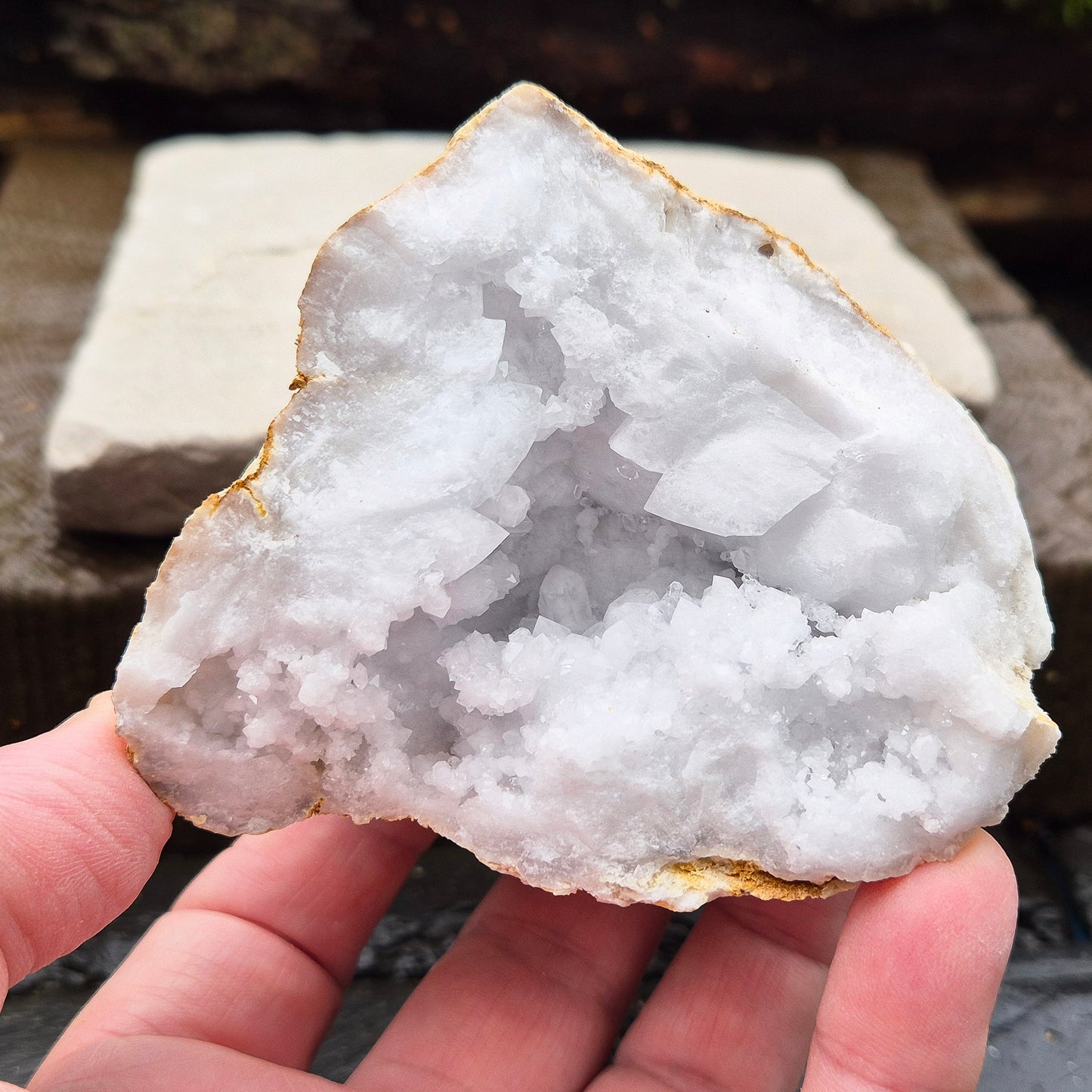 White Quartz Crystal Geode Half, from Morocco. Packed full of lovely sparkling white quartz crystal formations. It can sit on its own on an even surface.