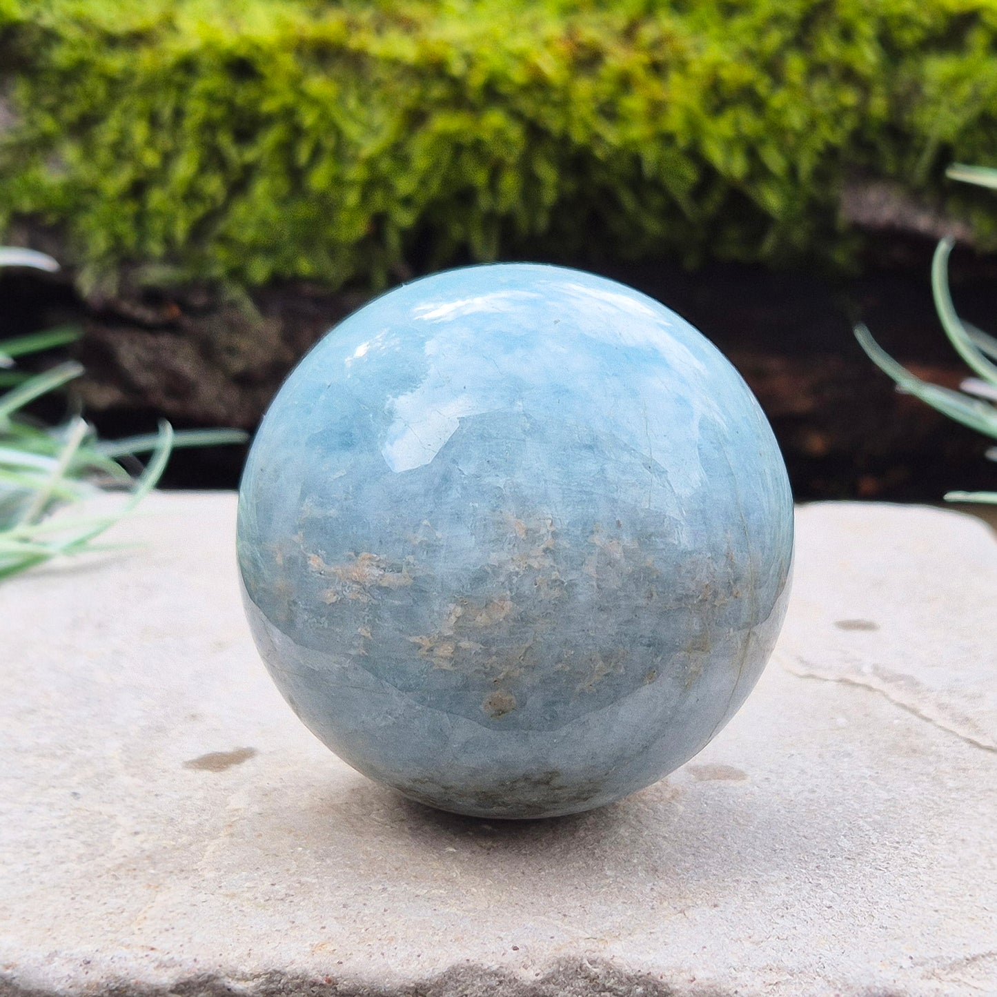 Enhance your space with an Aquamarine crystal sphere. Known for tranquility and clarity, it’s perfect for meditation and decor. 