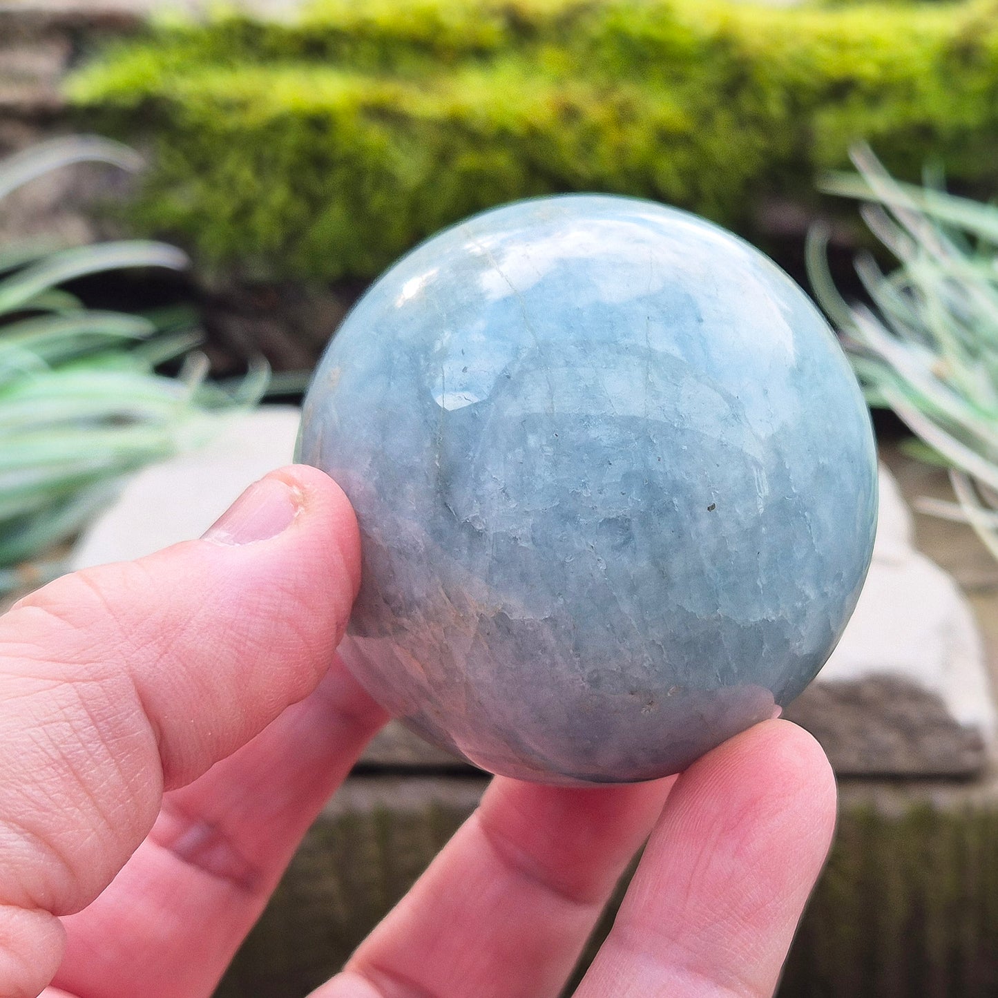 Enhance your space with an Aquamarine crystal sphere. Known for tranquility and clarity, it’s perfect for meditation and decor. 