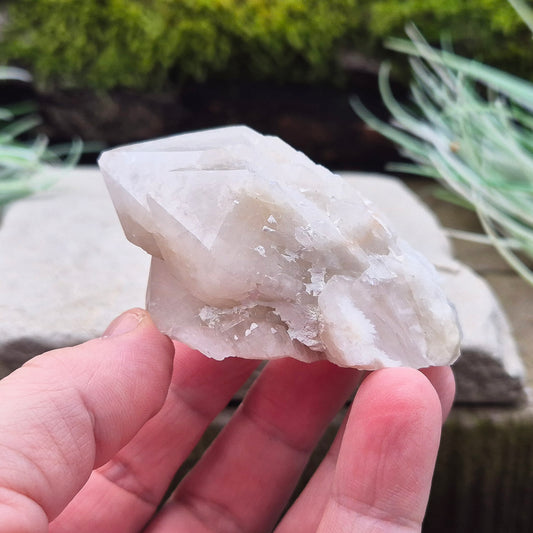 Candle Quartz Crystal Point from Madagascar, self-standing, with an appearance like melted wax flowing down the core, also known as Celestial Candle Quartz or Pineapple Quartz.