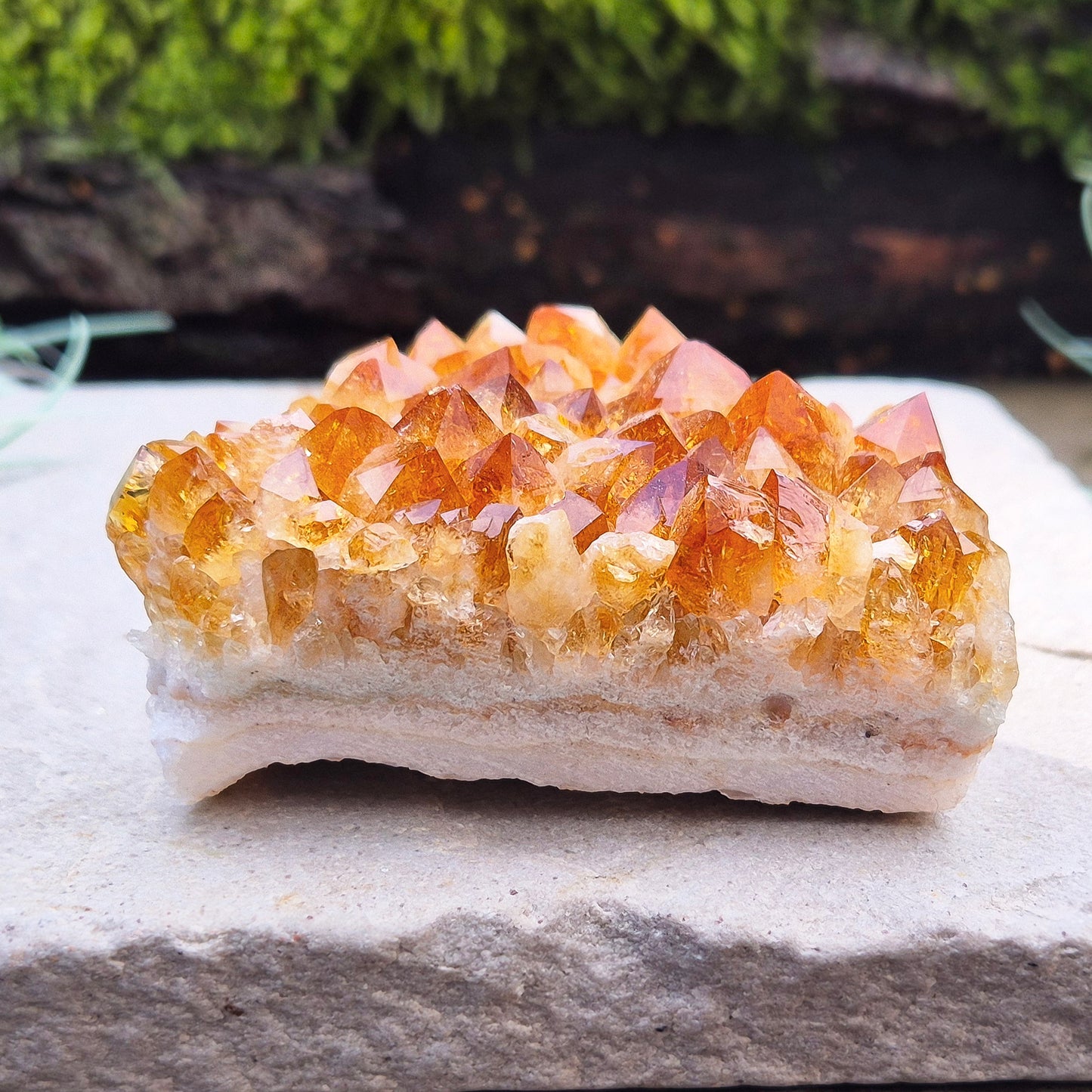 Citrine Crystal Cluster, Natural. From Brazil. Wonderful mid tone orange points on an even base which is even enough to sit on a flat surface.