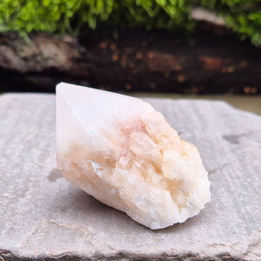 Candle Quartz Crystal Point from Madagascar, self-standing, with an appearance like melted wax flowing down the core, also known as Celestial Candle Quartz or Pineapple Quartz.