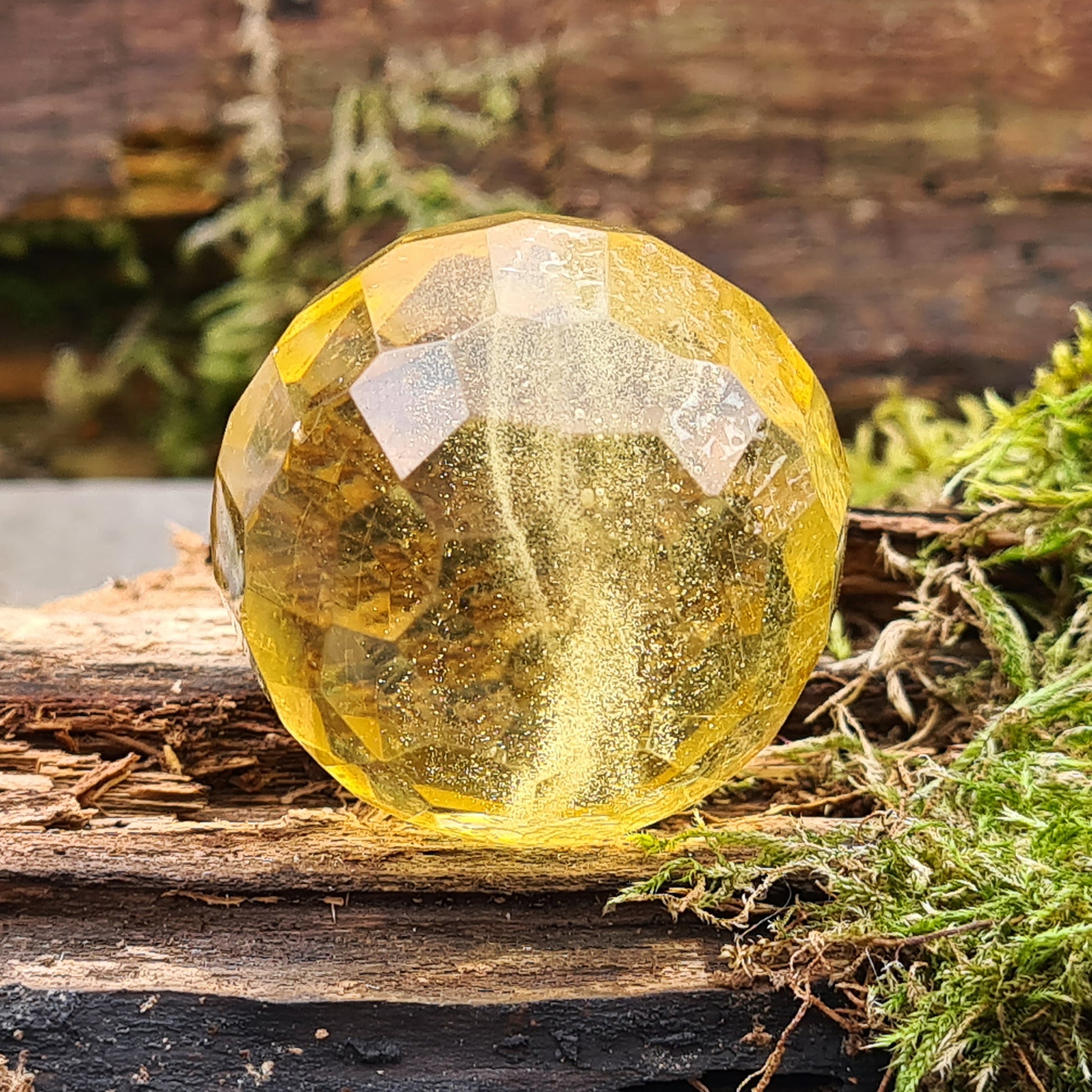Warm, golden amber sphere with faceted round shape, ideal for calming energy, protection, and balancing emotions. Perfect for collectors, healers and you.