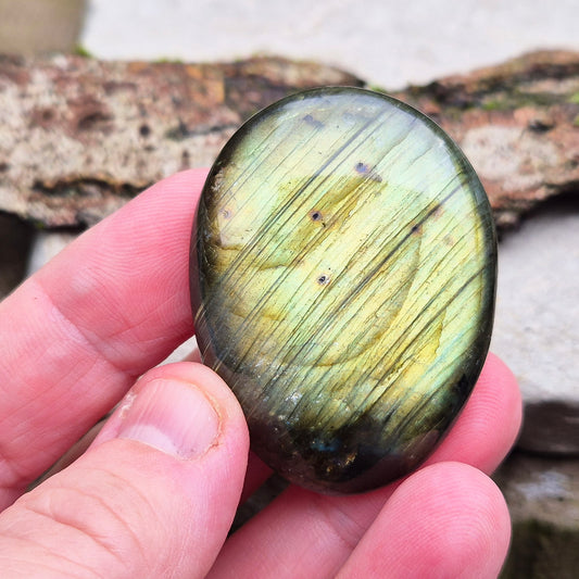 Polished Labradorite Crystal Palm Stone from Madagascar. Nice flashes of green, gold, and yellow in the light. 