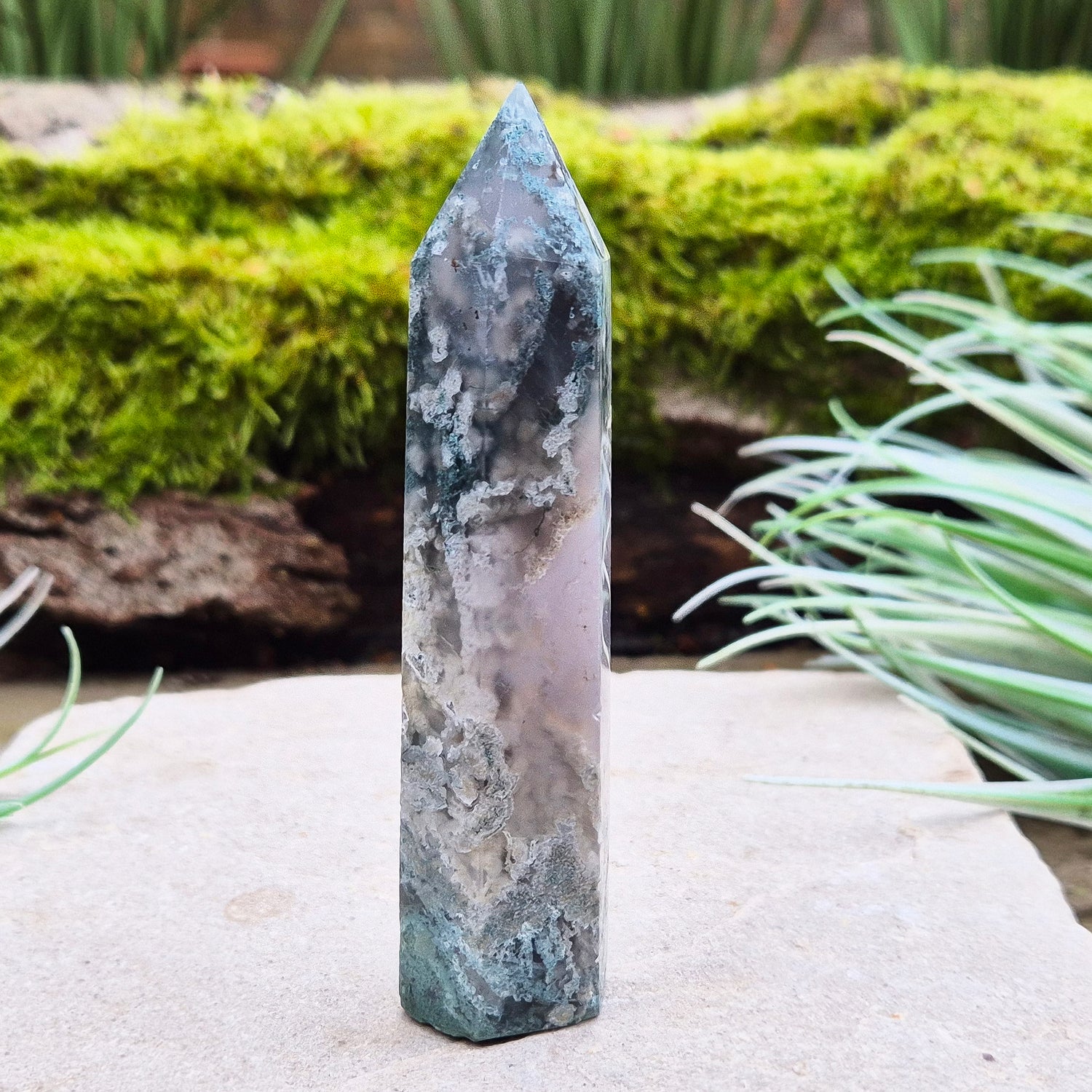 Elevate your space with a Moss Agate Tower, showcasing striking green patterns and earthy tones to promote balance, healing, and positive energy.