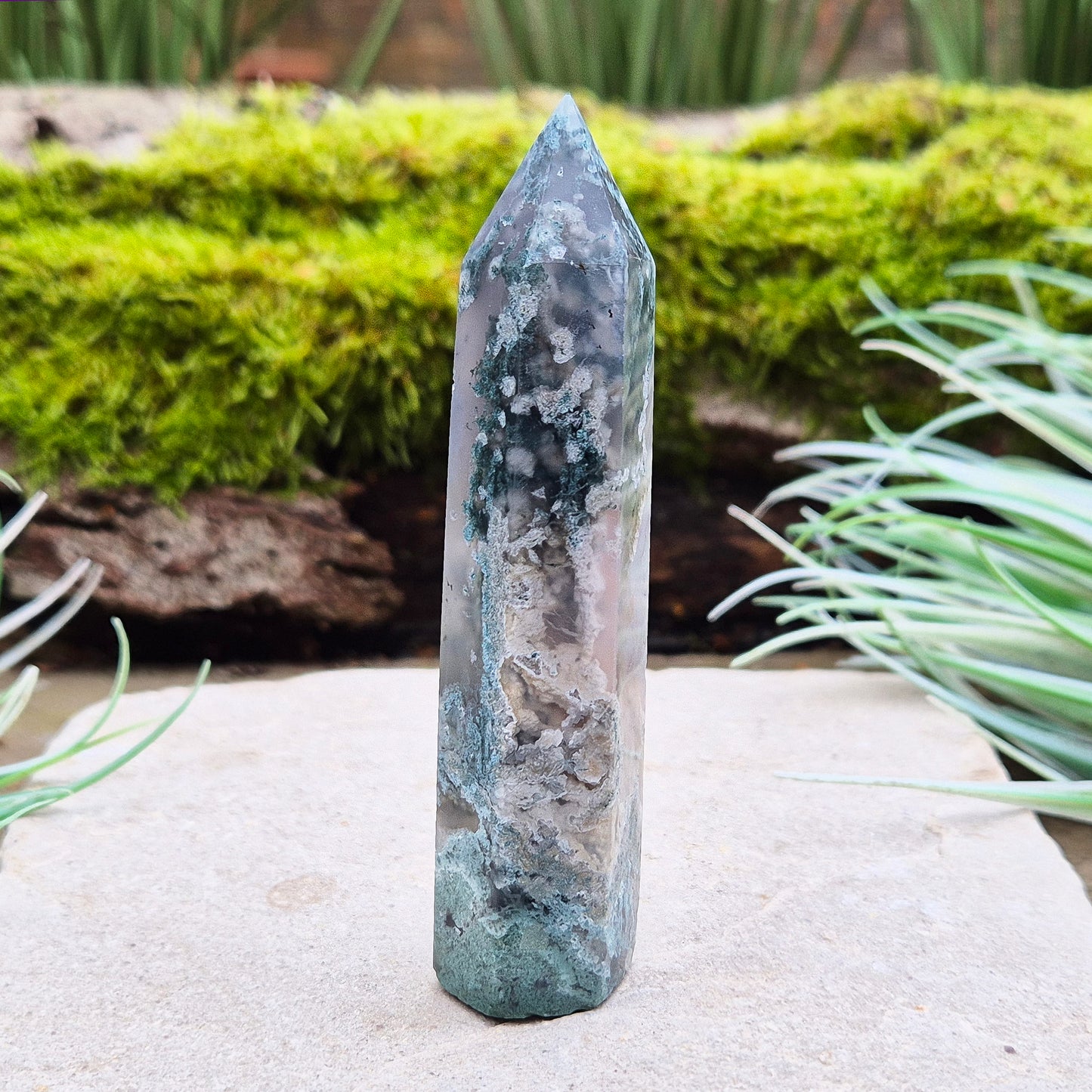 Elevate your space with a Moss Agate Tower, showcasing striking green patterns and earthy tones to promote balance, healing, and positive energy.