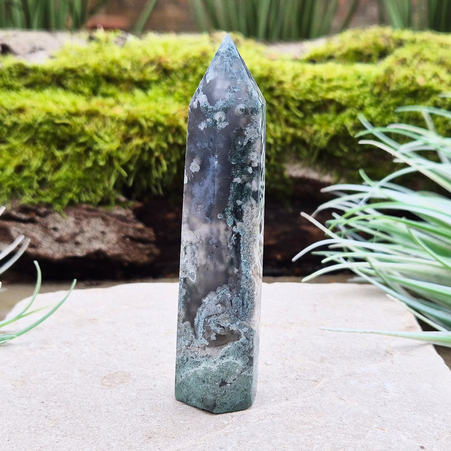 Elevate your space with a Moss Agate Tower, showcasing striking green patterns and earthy tones to promote balance, healing, and positive energy.