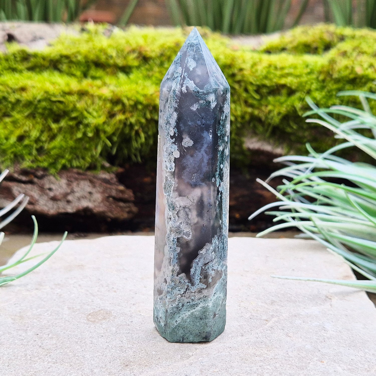 Elevate your space with a Moss Agate Tower, showcasing striking green patterns and earthy tones to promote balance, healing, and positive energy.