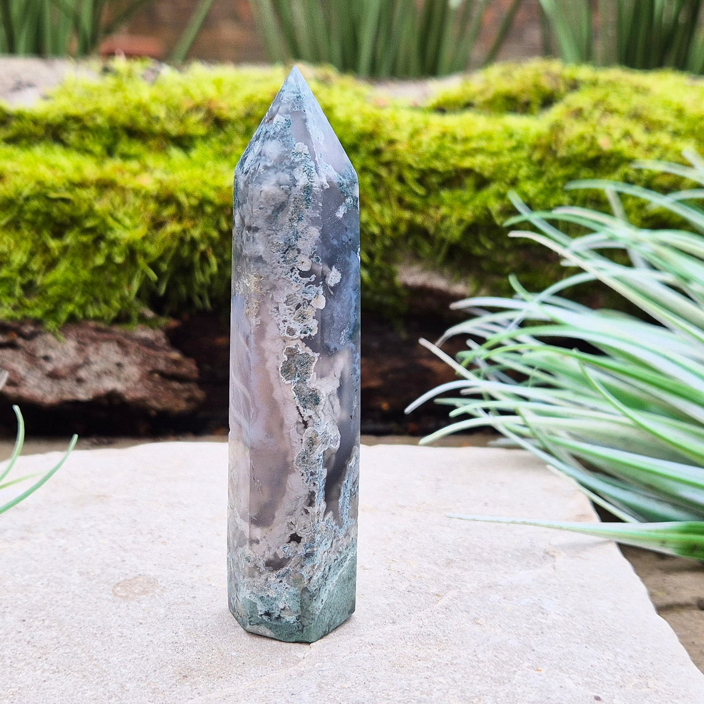 Elevate your space with a Moss Agate Tower, showcasing striking green patterns and earthy tones to promote balance, healing, and positive energy.