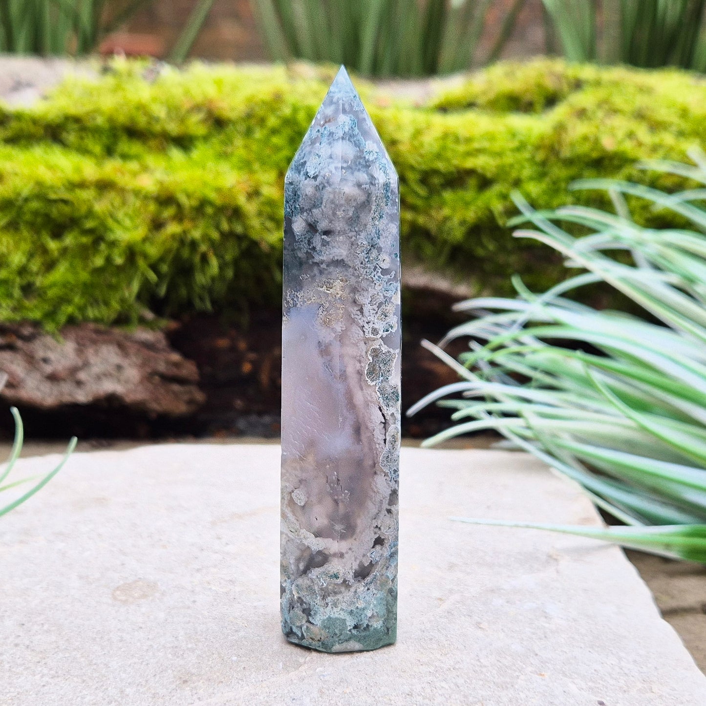 Elevate your space with a Moss Agate Tower, showcasing striking green patterns and earthy tones to promote balance, healing, and positive energy.