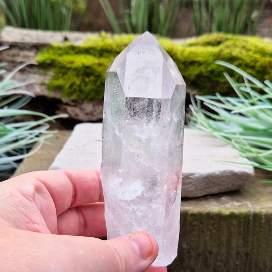 Quartz Crystal Point. From Brazil. This is a wonderfully natural quartz point with wispy inclusions and nice clear Clarity towards the top of this point.