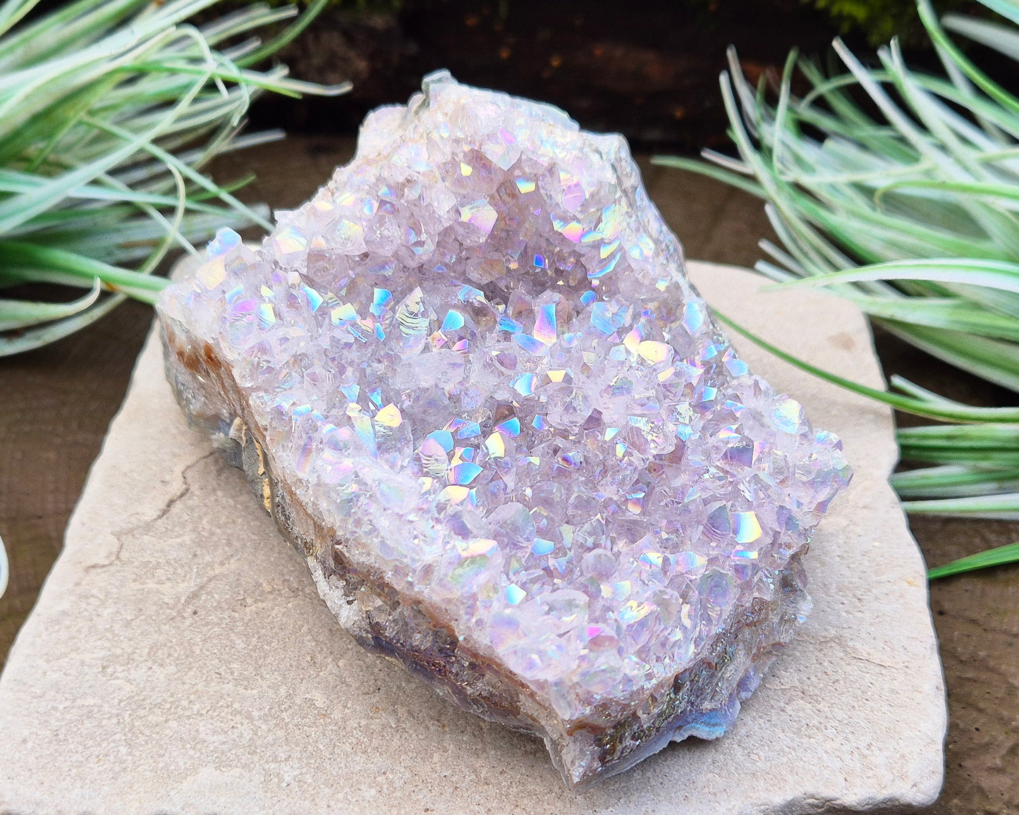 Sparkling Angel Aura Amethyst Crystal Cluster from Brazil. Base is curved but will sit on a flat surace.