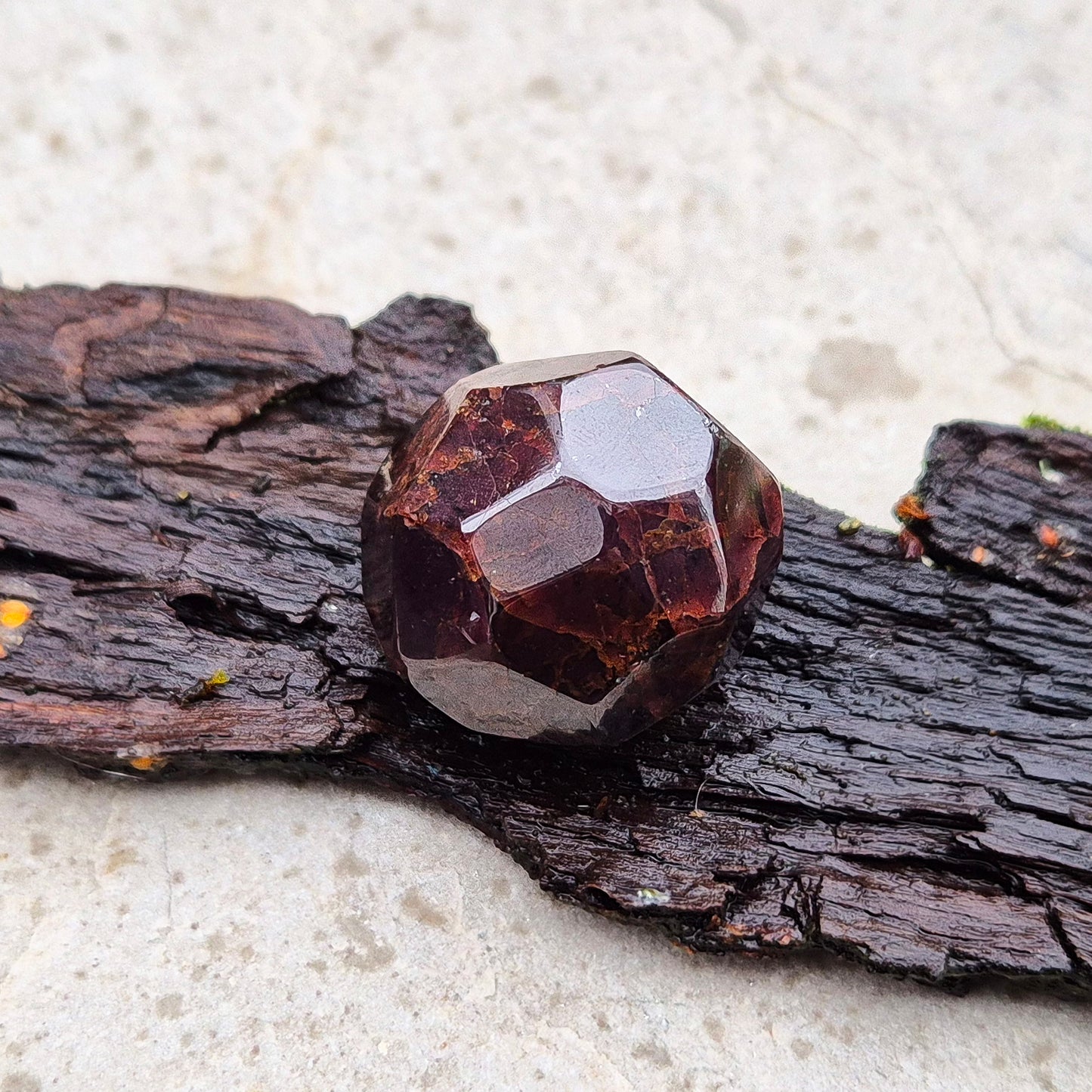 Almandine Garnet Crystal from India, featuring deep reddish-brown hues. Also known as Almandite