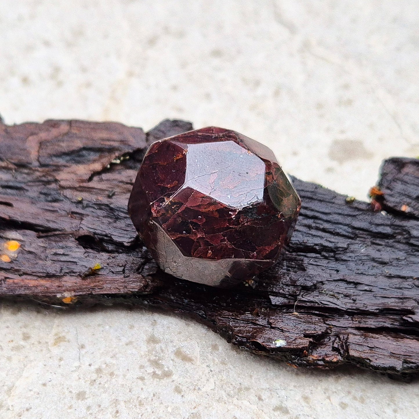 Almandine Garnet Crystal from India, featuring deep reddish-brown hues. Also known as Almandite