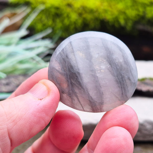 Lunar Quartz Crystal Plam Stone, also known as Lunar Rose Quartz, comes from Namibia. It is a blend of Rose Quartz and Graphite