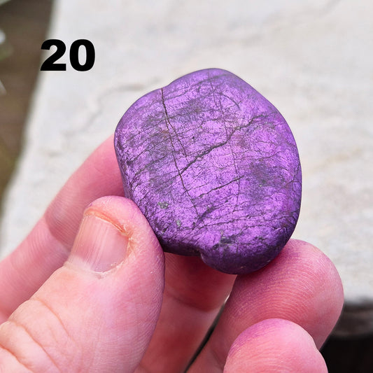 Purpurite. Beautiful purple specimens originating from Namibia. Known for its vibrant purple hue and unique matte, dusty finish. In the right light the purple hue will be more visible.
