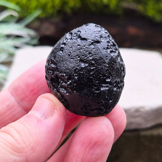 Black Tektite (Indochinite, A Grade) – Dark, glass-like stones formed 700,000 years ago by meteorite impacts that ejected material into Earth’s upper atmosphere. 