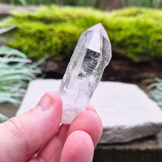 Starbrary Quartz Crystal Point From Brazil. This crystal is a point has nice clarity and lovely starbrary markings on 3 sides.