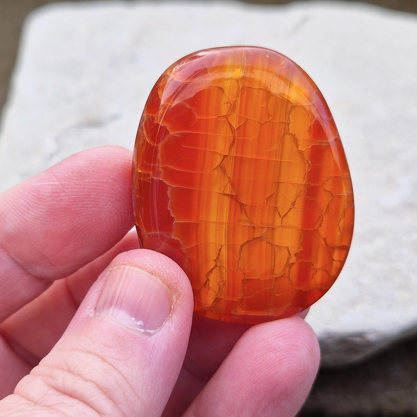 Crackle Agate Palm Stone. Crackle Agate is a stunning variety of chalcedony, a microcrystalline form of quartz, that undergoes a special heat treatment to create intricate internal fractures.