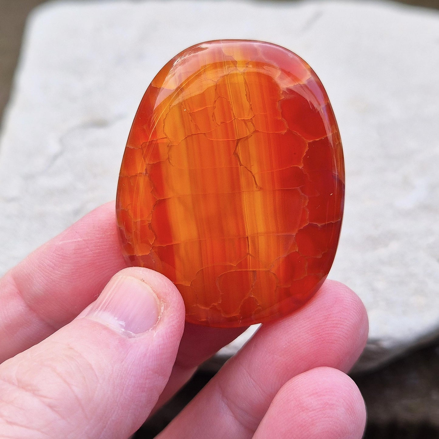 Crackle Agate Palm Stone. Crackle Agate is a stunning variety of chalcedony, a microcrystalline form of quartz, that undergoes a special heat treatment to create intricate internal fractures.