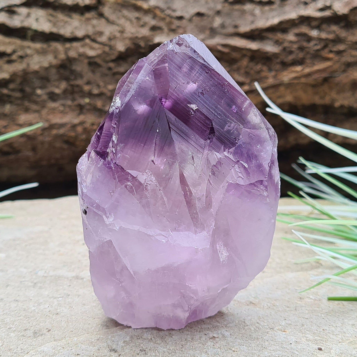 Amethyst standing point from Brazil. This is a great crystal with lovely purple colouring. Point is polished, the rest is left natural. 