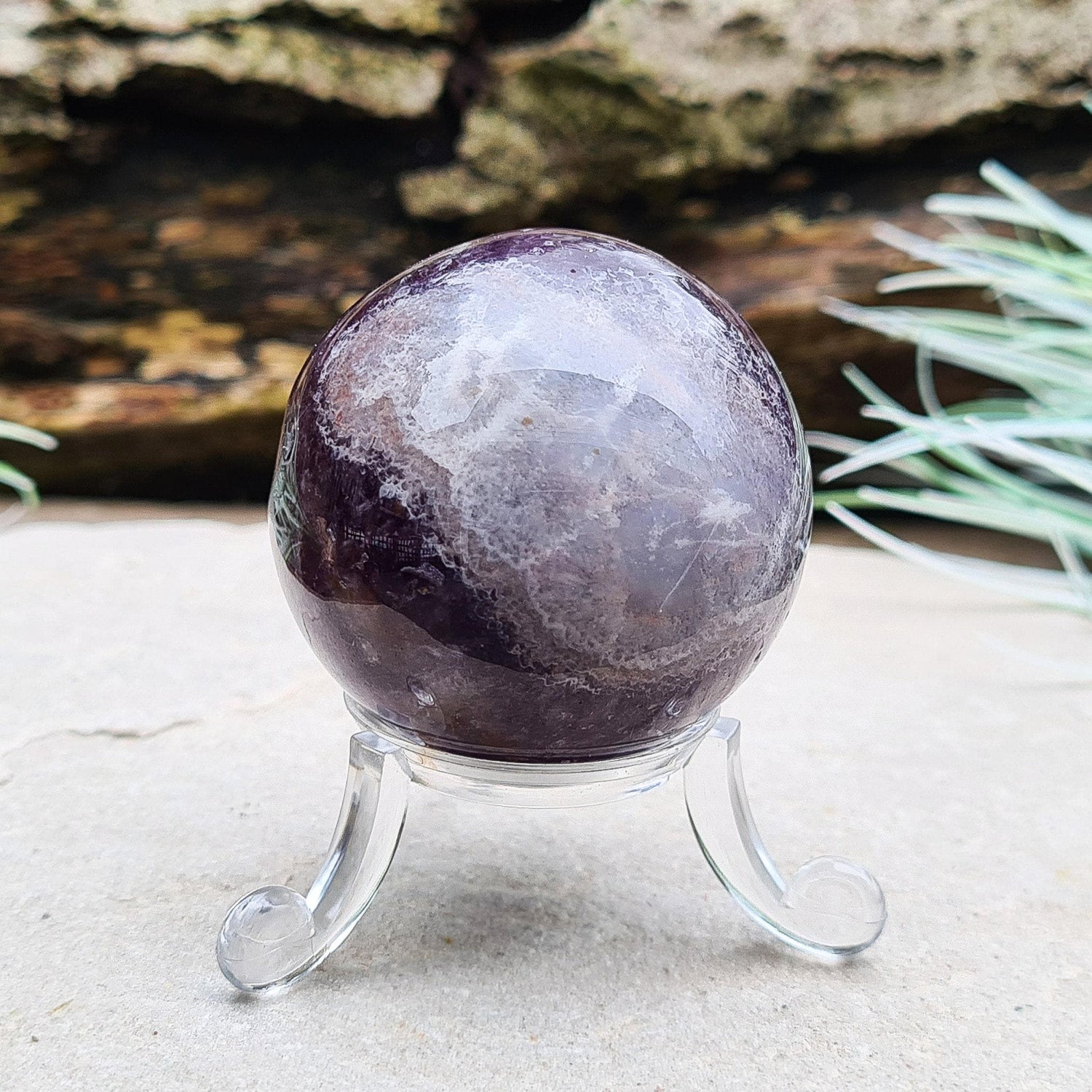 This Chevron Amethyst Crystal Sphere features natural banding of deep purple Amethyst and white Quartz. It’s a beautiful and distinctive piece—well-loved by those who feel drawn to crystals that evoke clarity and balance.