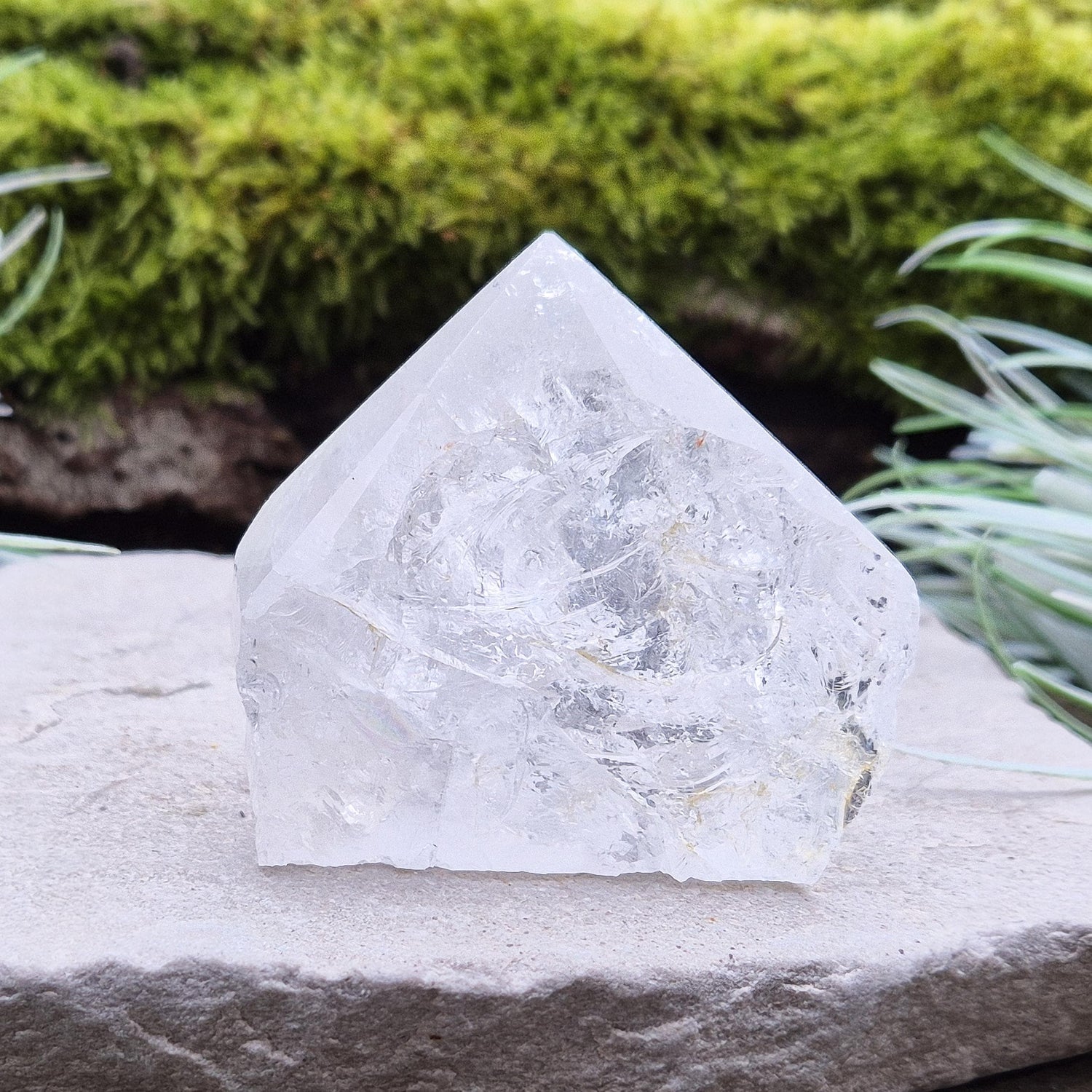 Quartz Crystal Standing Point,&nbsp;from Brazil. Point is polished at tip, sides are natural and the base is cut flat so it will sit on an even surface. Lovely clarity and light refraction within it.