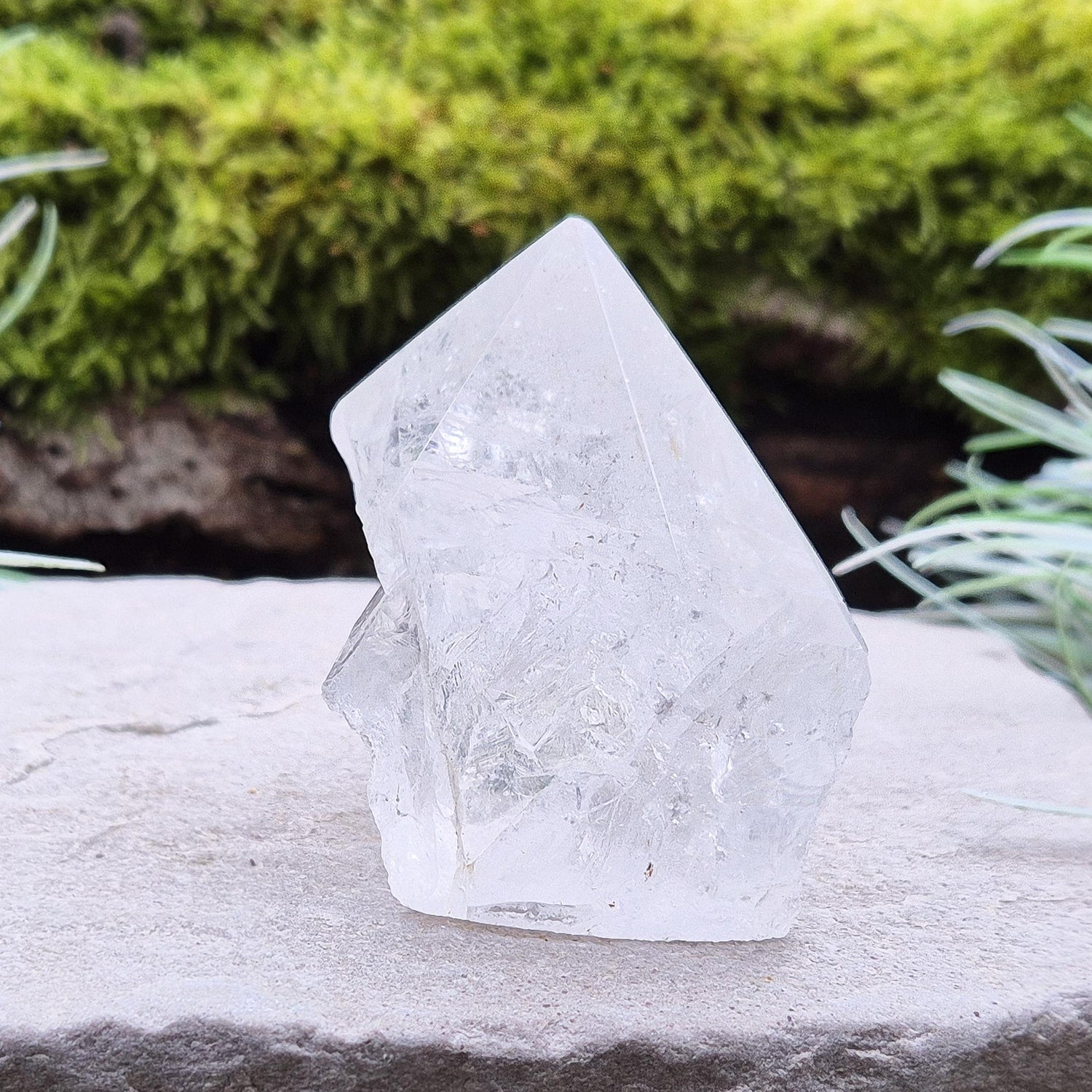 Quartz Crystal Standing Point, from Brazil. Point is polished at tip, sides are natural and the base is cut flat so it will sit on an even surface. Lovely clarity and light refraction within it.